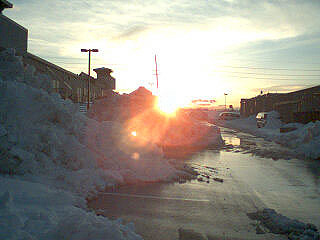 Sunset over snowbank.